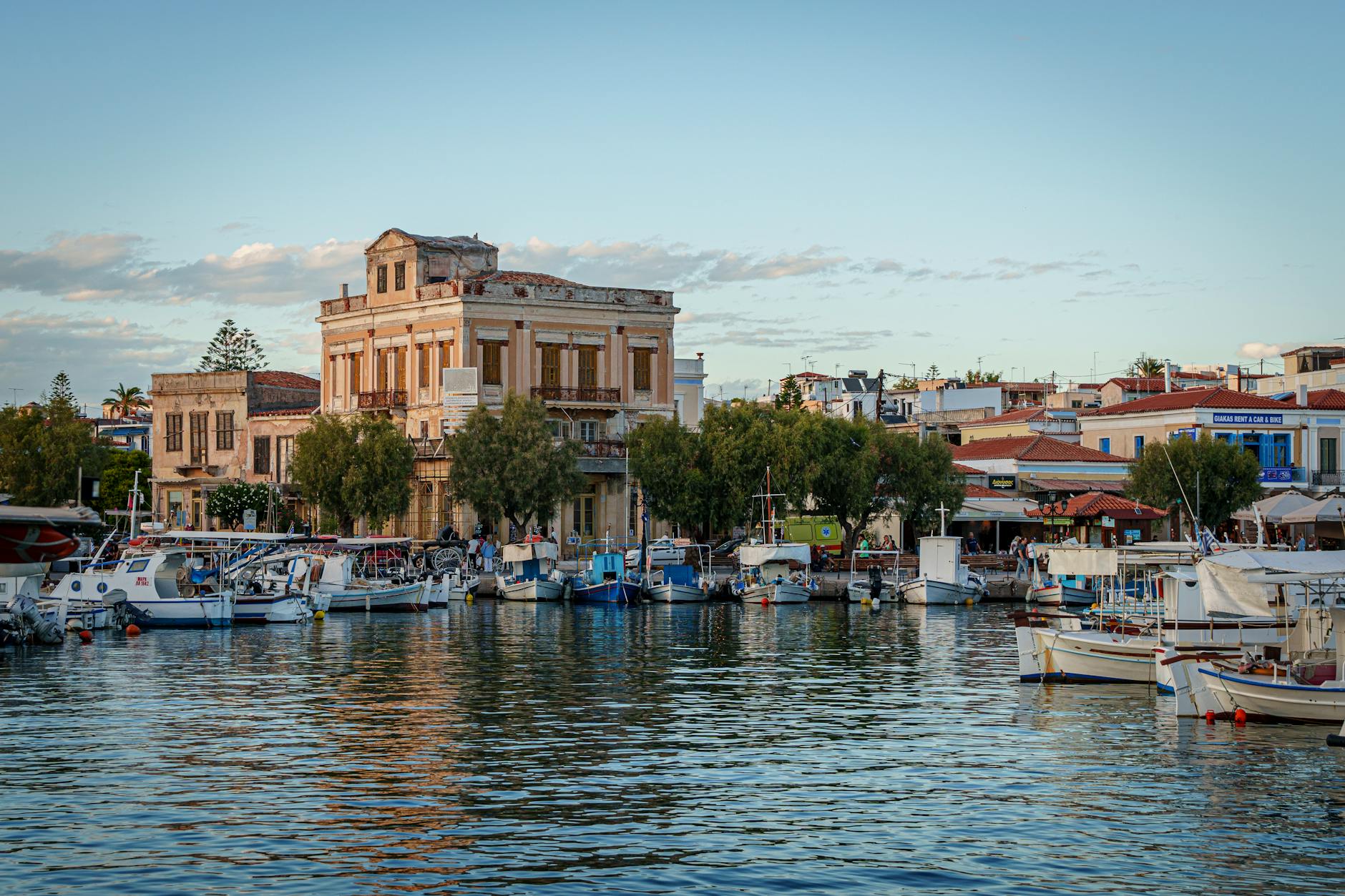 Beautiful marina with boats and historic architecture on Aegina Island in the Saronic Gulf Greece