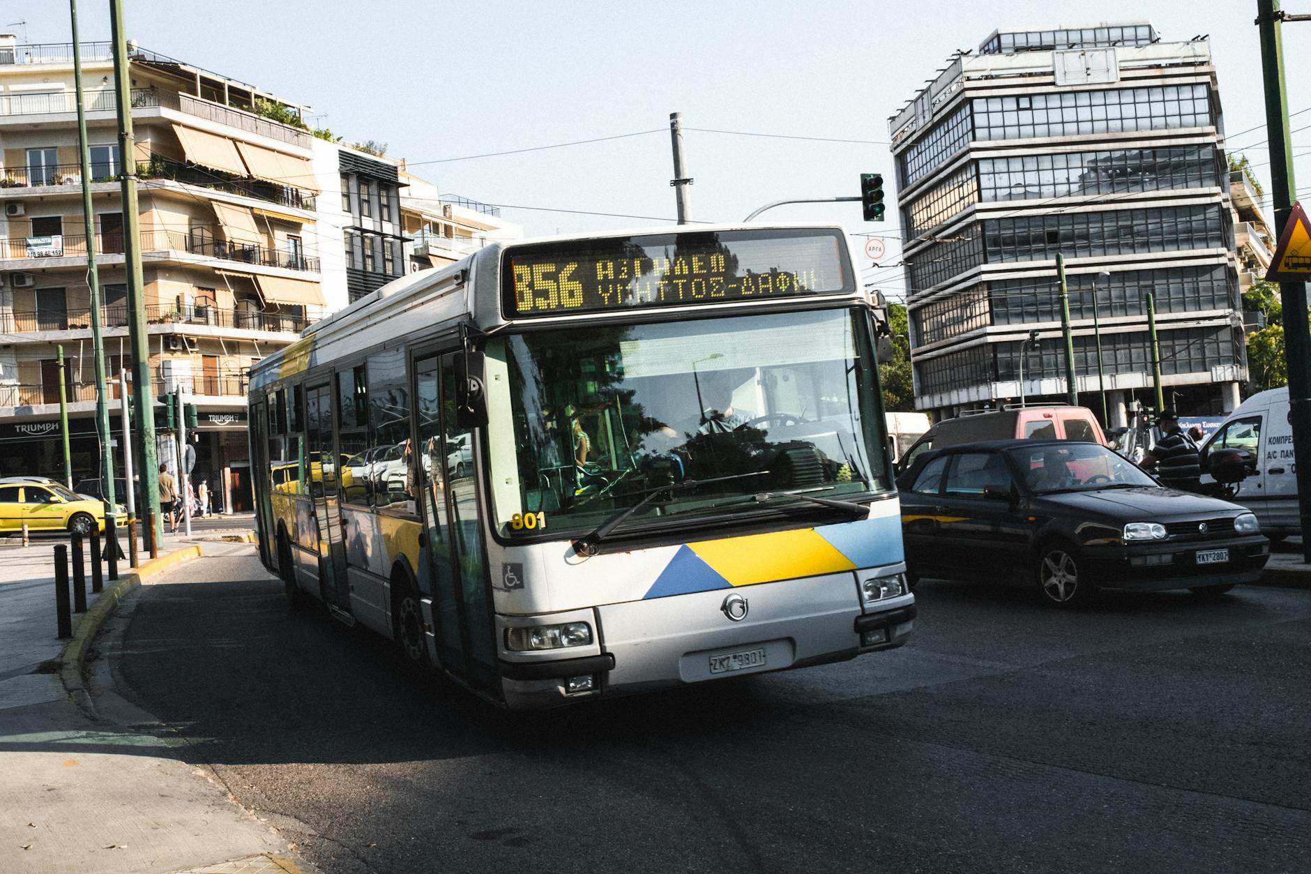 Athens public bus at a city stop providing affordable transport across the metropolitan area