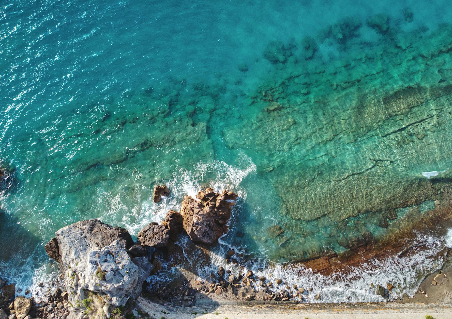 Aerial view of the Athens Riviera coastline with turquoise waters and sandy beaches
