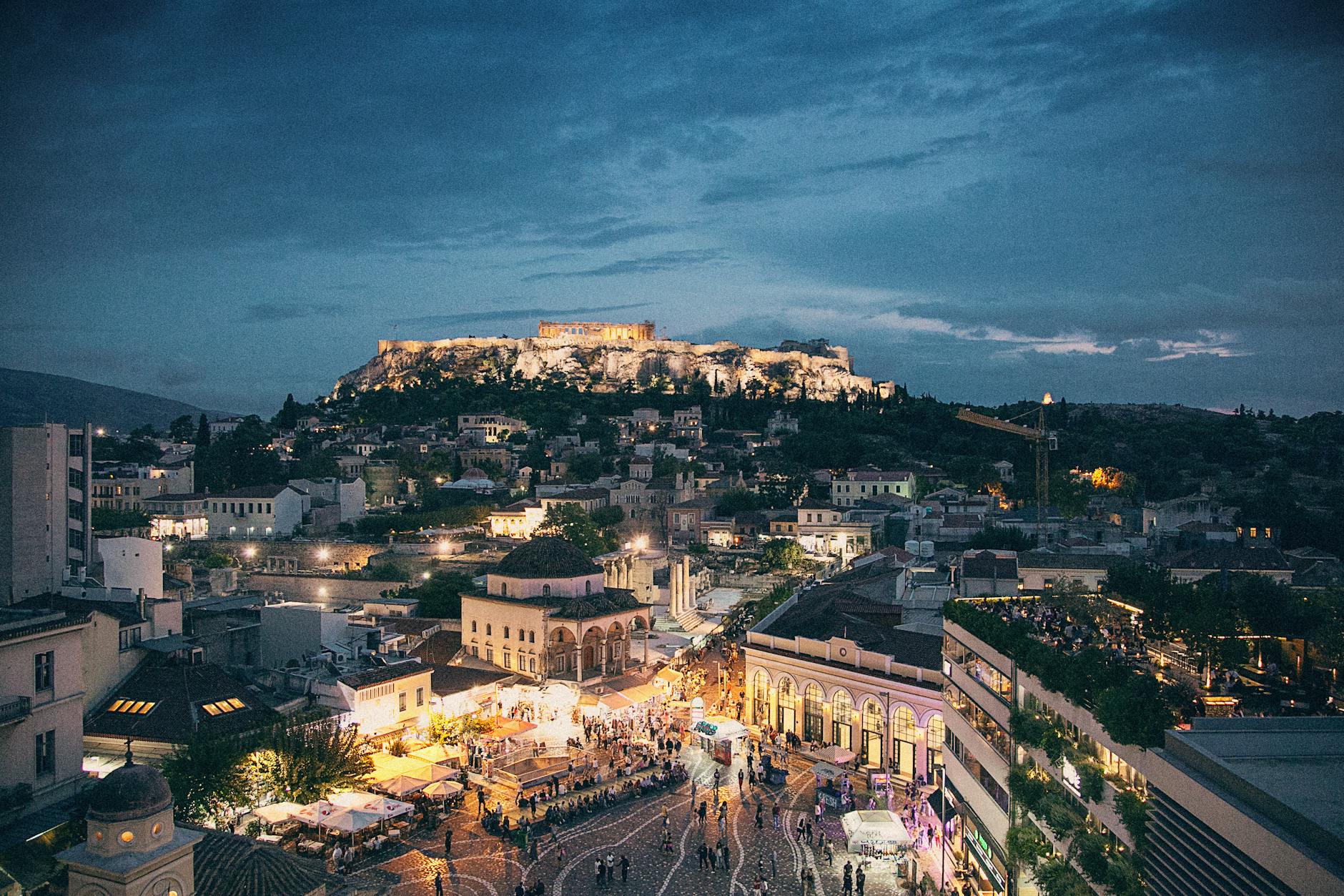 Rooftop bar in Athens with city lights and illuminated views at night