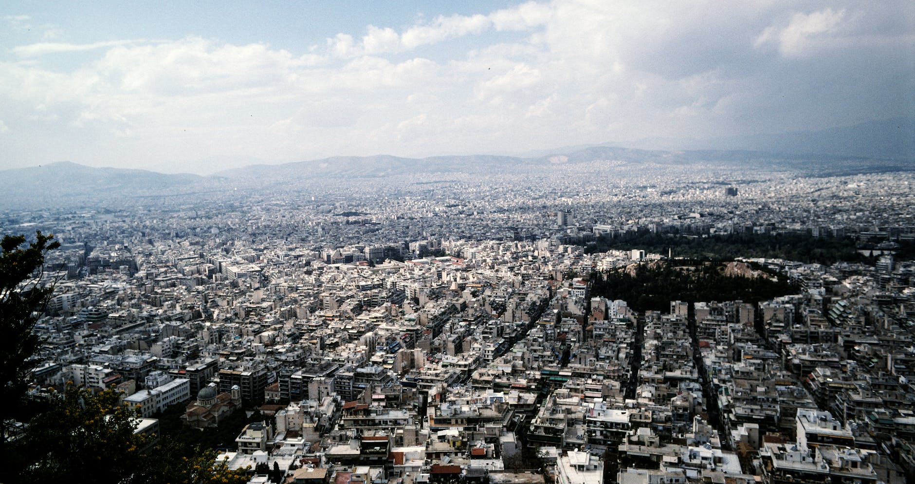 Planning a trip to Athens Greece with guidebook and map