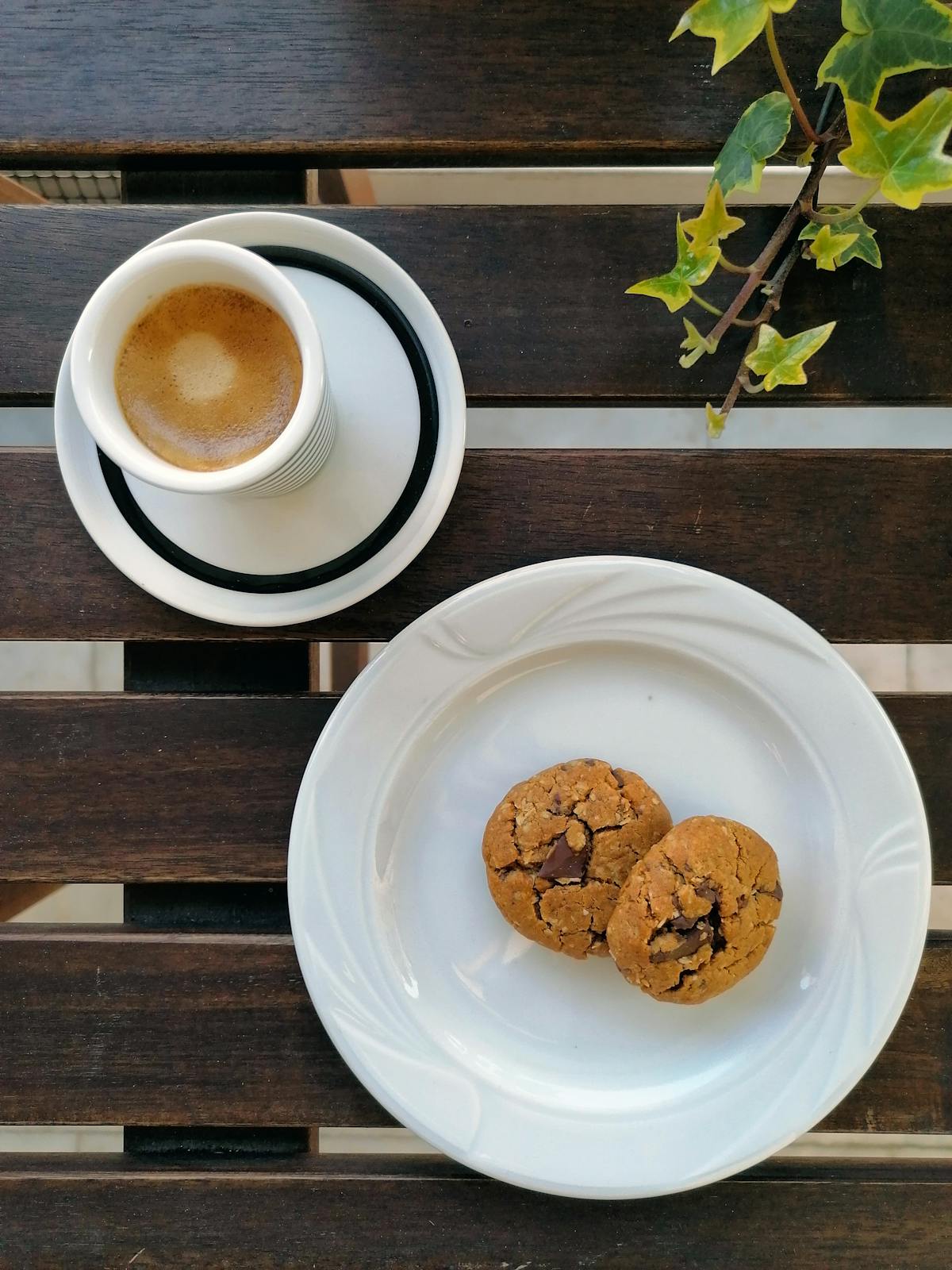 Cup of Greek coffee with cookies on a wooden table