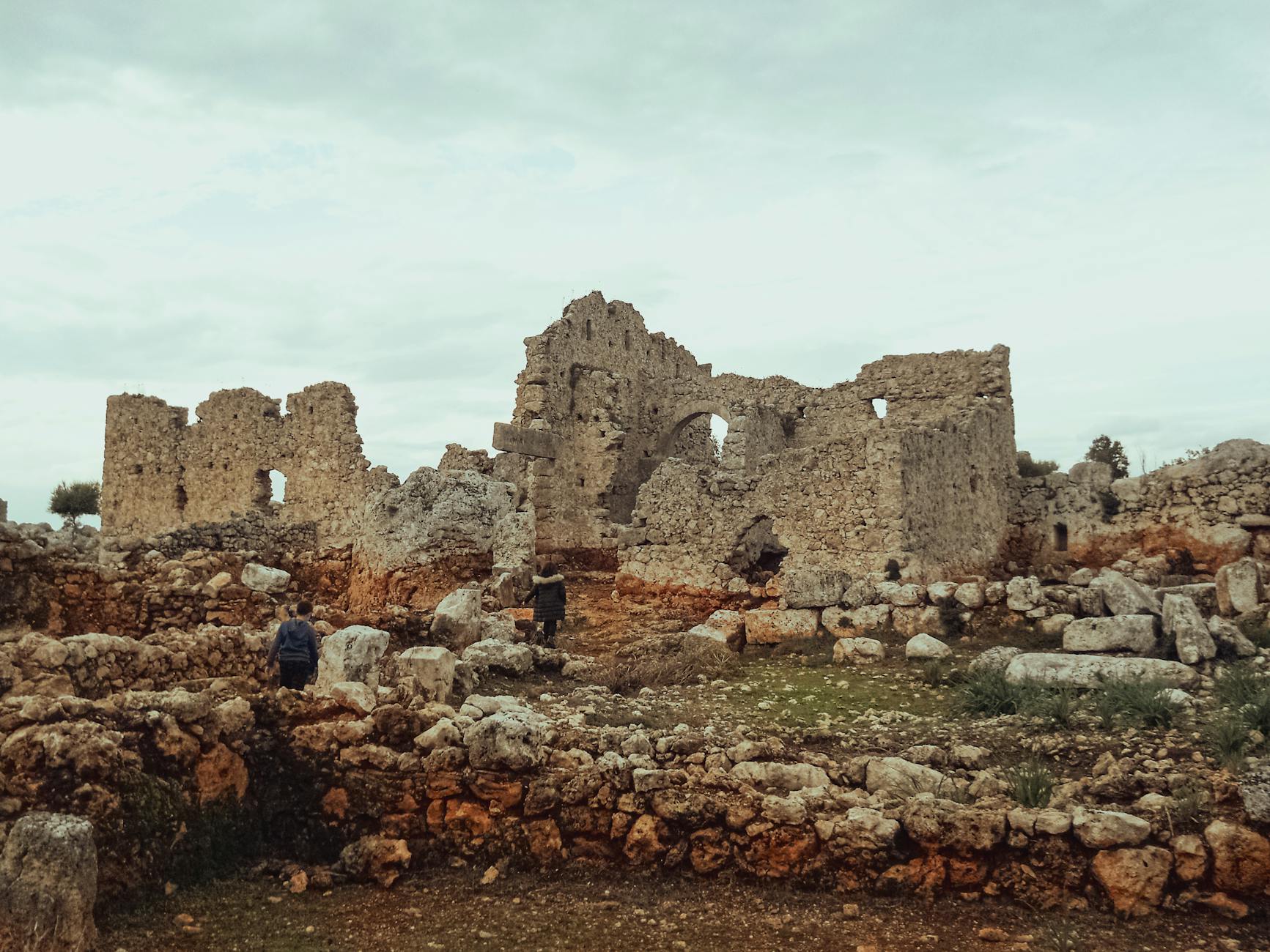 Children exploring ancient ruins on a family trip