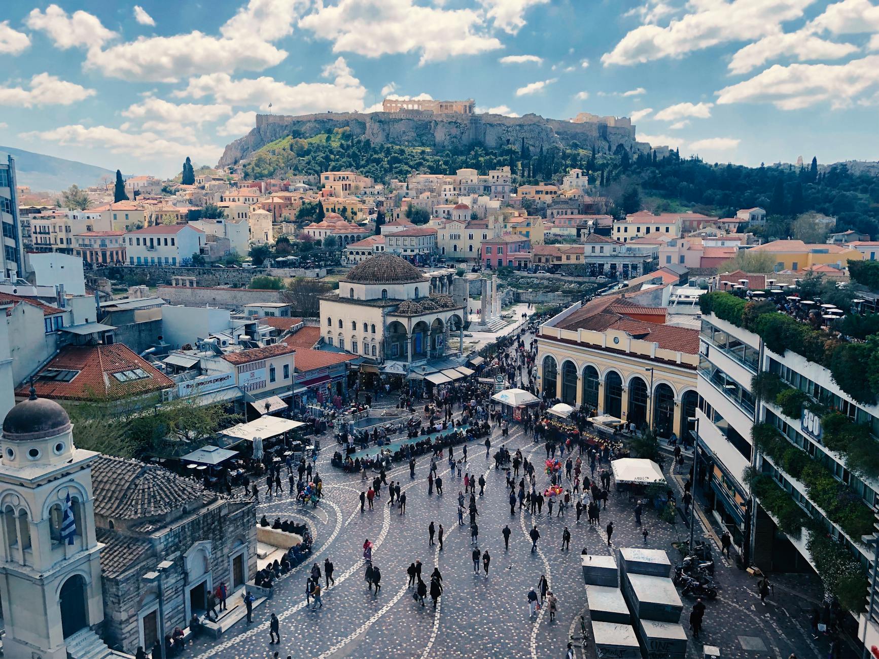 Bustling Monastiraki Square with views of the Acropolis
