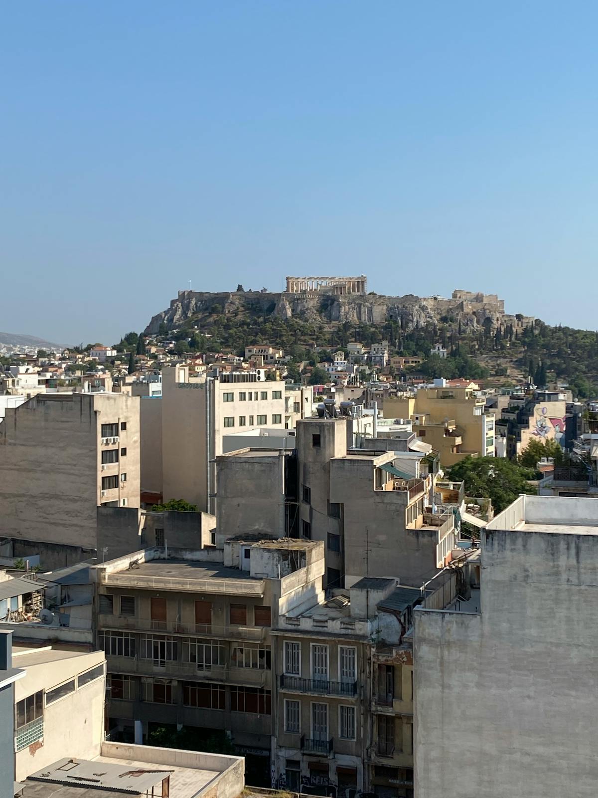 Rooftop view of the Acropolis from an Athens hotel terrace
