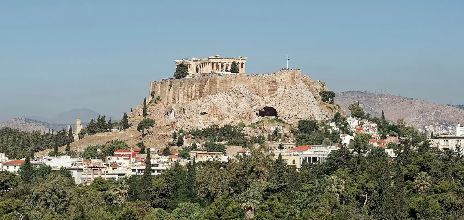 The Acropolis above the pines, seen from the Panathenaic Stadium, two stops on a 2 days in Athens itinerary