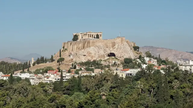 The Acropolis above the pines, seen from the Panathenaic Stadium, two stops on a 2 days in Athens itinerary