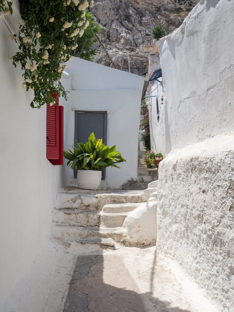 Whitewashed steps and walls in a narrow lane of Anafiotika, Athens