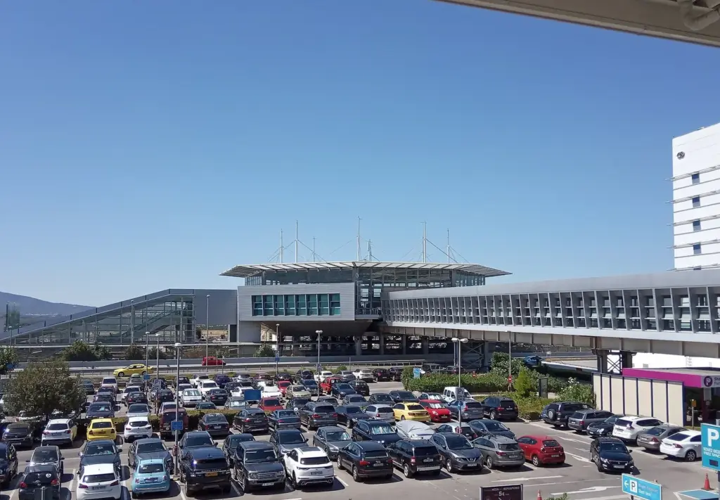 The Athens airport railway and metro station building seen across the airport car park