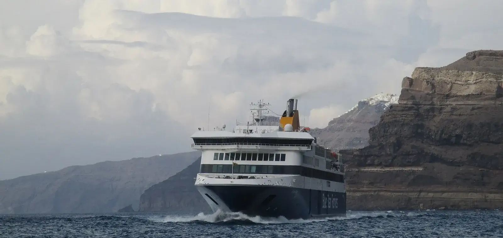 Blue Star ferry in Santorini's caldera, the view that ends an Athens to Santorini ferry crossing