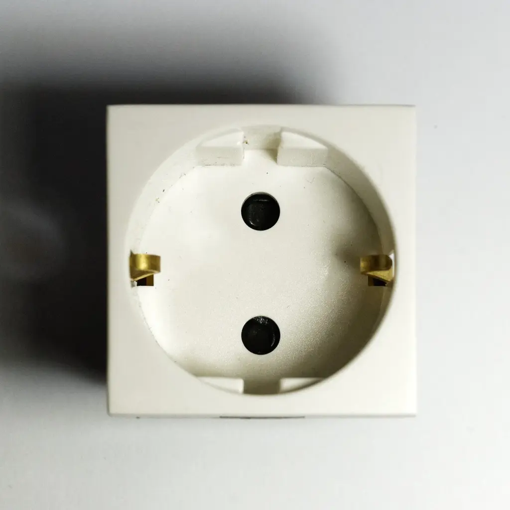 Checking the plug type and adapter for Greece: a Type F socket with two round holes and brass earthing clips
