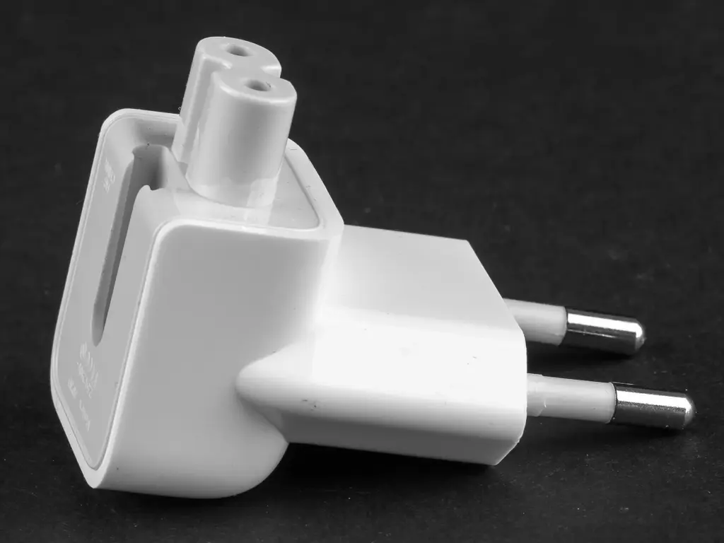 White laptop charger plug head with two round European pins