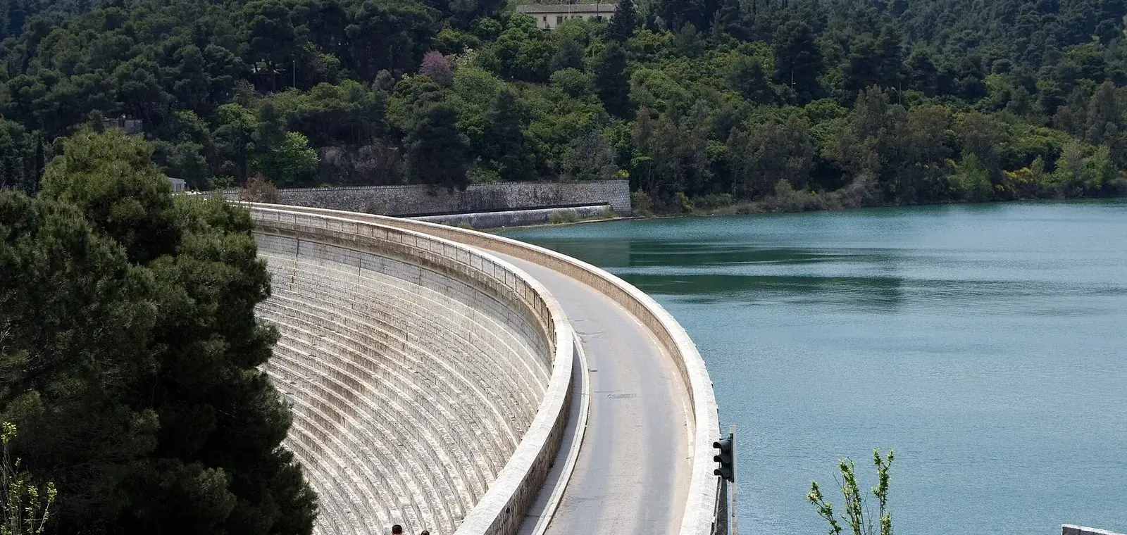 Marathon Dam curving across the valley beside Lake Marathon, one of the reservoirs behind Athens tap water