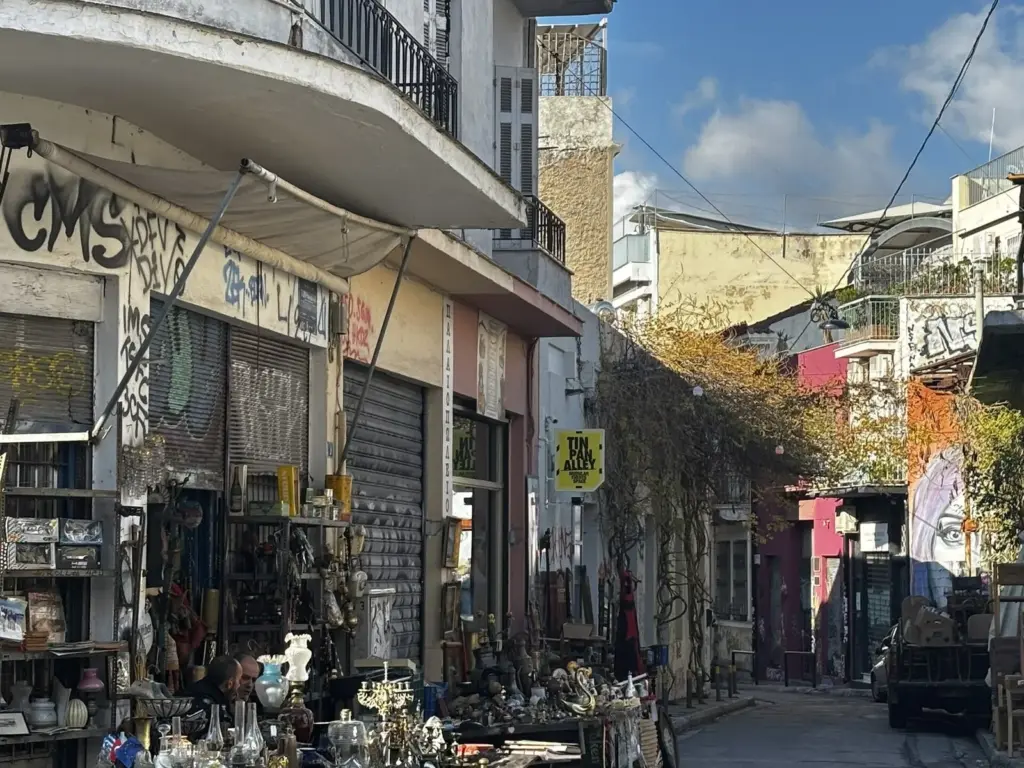 Antique and bric-a-brac shops with goods spread onto the street in Monastiraki's flea market area