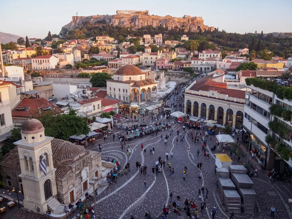 Monastiraki Square from above, with the metro station's arcaded building, the Tzistarakis Mosque and the Acropolis on the skyline