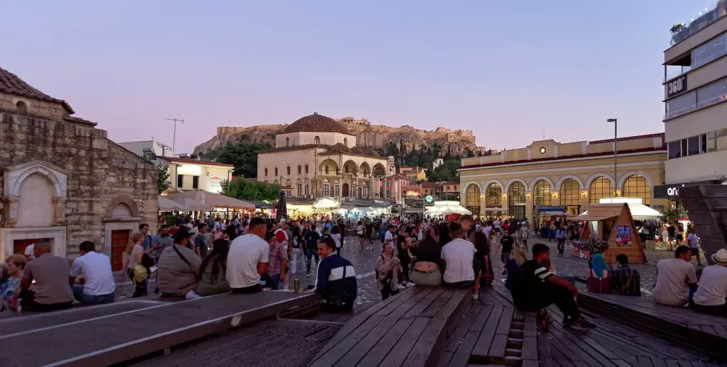 Monastiraki Square at dusk with the Tzistarakis Mosque and the Acropolis behind