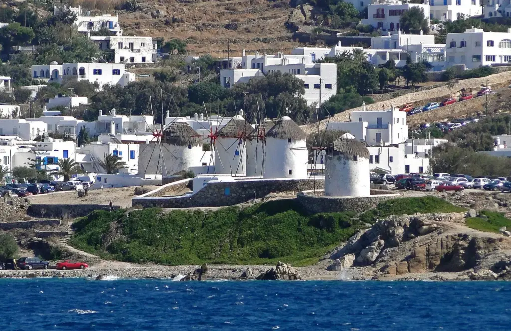 The windmills above Mykonos town seen from the sea