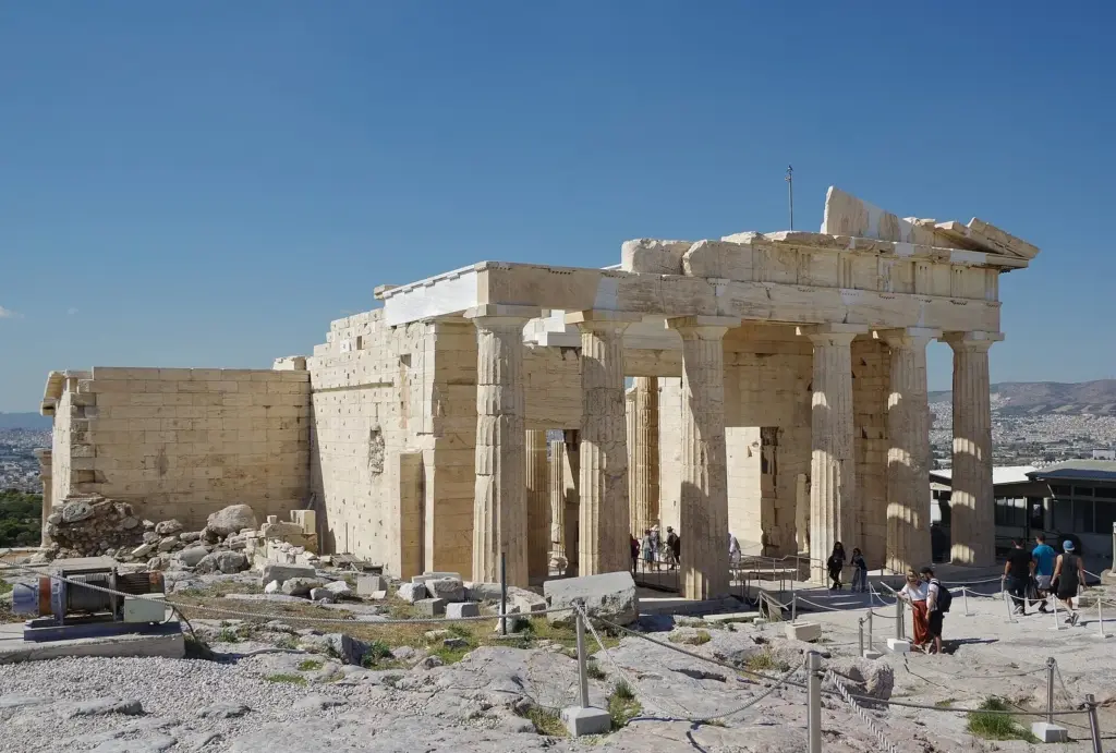 The Propylaea, the marble gateway to the Acropolis, under a clear blue sky