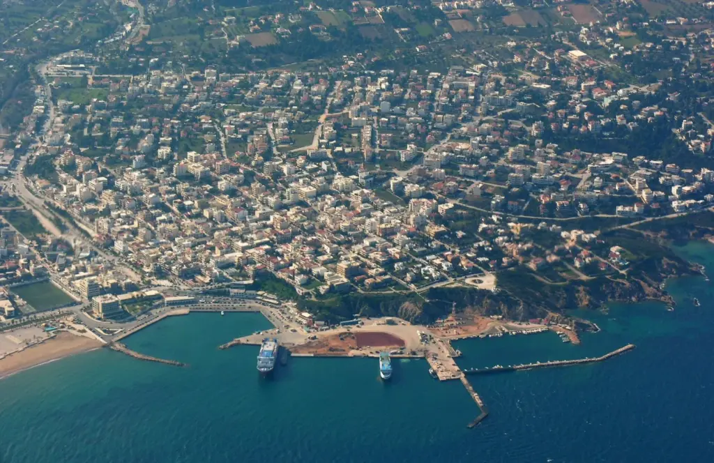 Aerial view of Rafina, with the town spread over the hillside and ferries moored in the harbour below