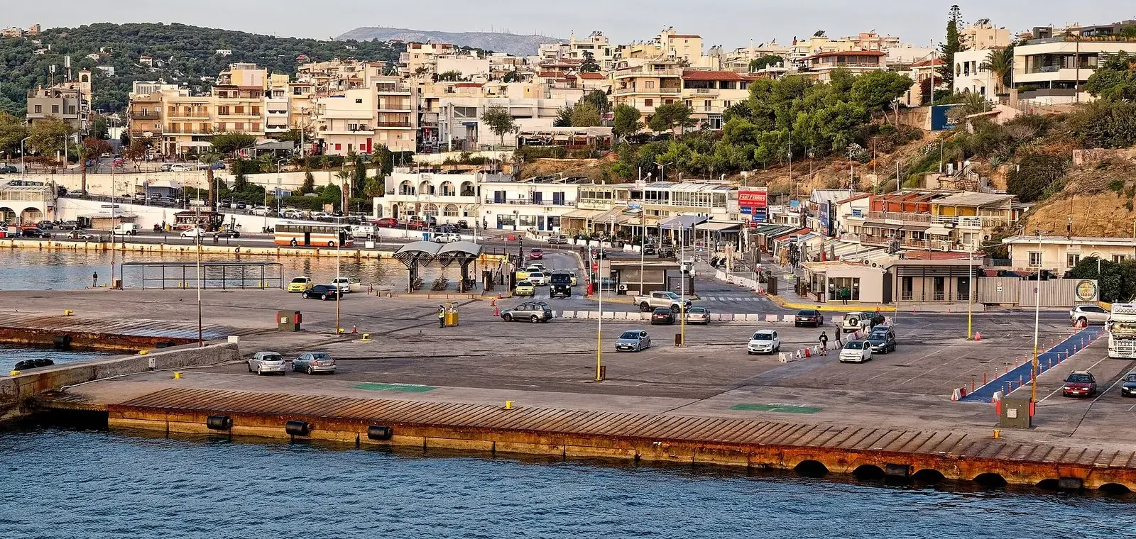 Rafina port ferries from Athens leave from this quay, seen from a departing ship with the town on the hill behind
