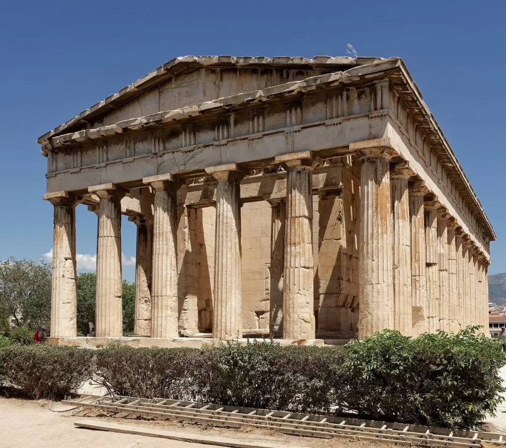 The Doric Temple of Hephaestus in the Ancient Agora of Athens under a clear blue sky