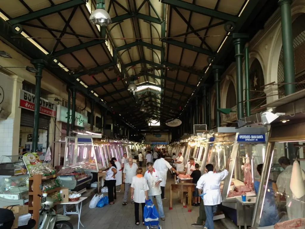 Butchers' counters under the iron roof and skylights of the Varvakios central market in Athens